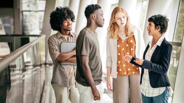 Group of diverse students discussing career opportunities while pursuing an engineering technology degree.