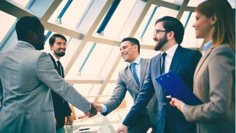 Business Consumer Alliance – professionals shaking hands to build trust between businesses and consumers.