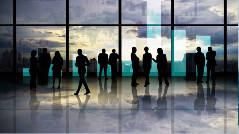 Business professionals analyzing stock market data and trends during premarket trading hours.