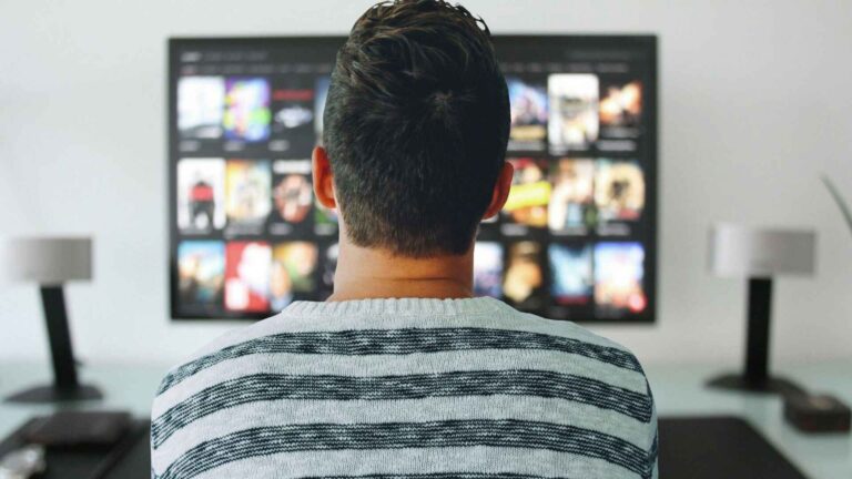 Person streaming animated shows on TV – best sites to watch cartoon online free in HD