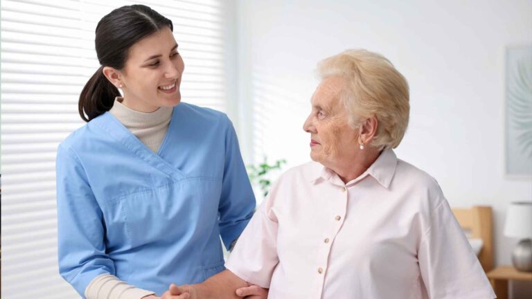 Nurse assisting an elderly patient at Banner Health Center in Maricopa, Arizona.