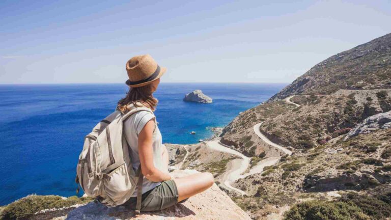 Traveler enjoying scenic coastal view at one of the top Europe travel destinations.