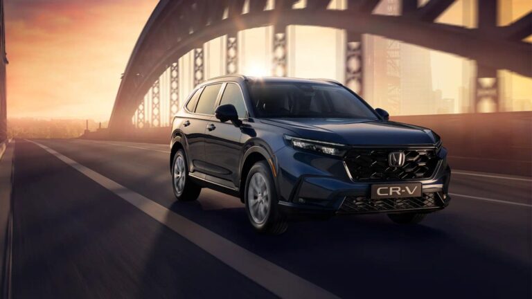 Discover Honda Cr-V New Features Design Innovations Honda CR-V new features design showcasing the sleek 2026 model driving across a modern bridge at sunset